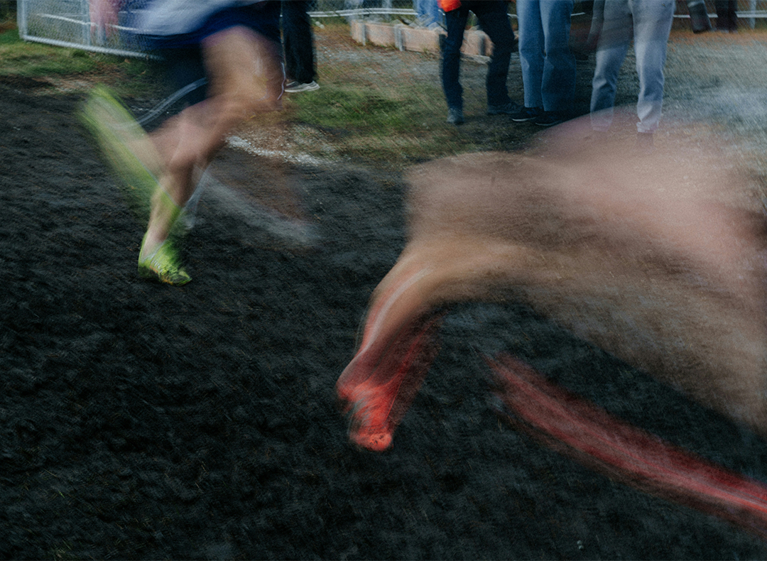 Person running on a dirt track